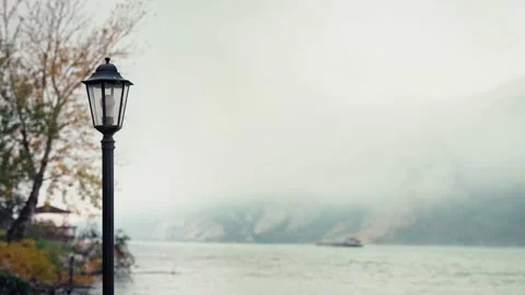 Street lantern on the background of the river and mountains Stock Footage 224842354