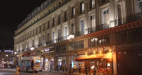 Street Level Night View of Illuminated Haussmann Buildings Near Opera District Stock Footage 334636712