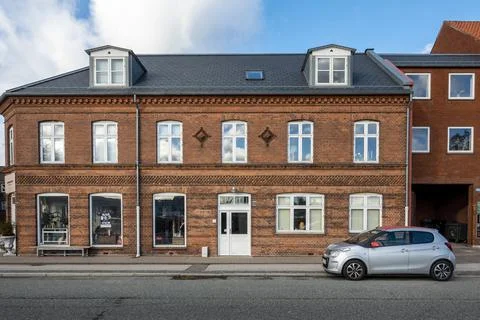 Street level view of a multi-storey building with classic European architectu Stock Photos