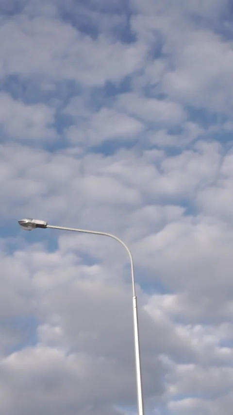 Street light. Footage. The cloudy sky in the early morning hours when the sun is Stock Footage 306501782