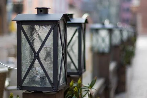 A street light in front of old square and empty old town street during covid- Stock Photos