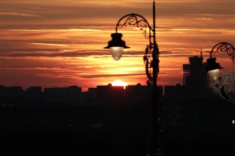 A street light in front of a sunset Stock Photos