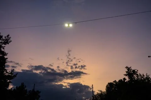 Street light night view with sunset and violet sky and tree Stock Photos