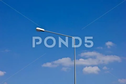 Street Light Pole On A Sunny Day And Blue Sky