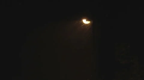 Street light with rain passing in front of it Video stock 45842602