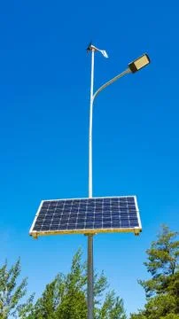 Street lighting using solar panel and wind generator. Stock Photos