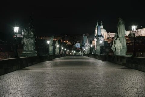 Street lights on the old stone Charles Bridge in the center of the city of Pr Stock Photos