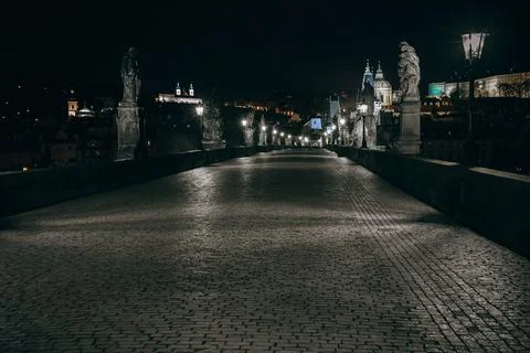 Street lights on the old stone Charles Bridge in the center of the city of Pr Stock Photos