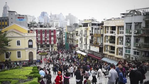A street in Macao crowded with people Stock Footage 72333652