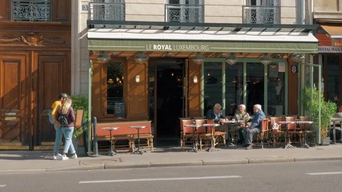 Street in Paris with small roadside cafes, France Stock Footage 89015341