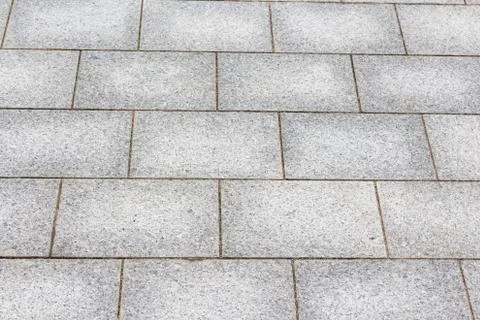 A street pavement of antique rectangular floor tiles. 스톡 사진