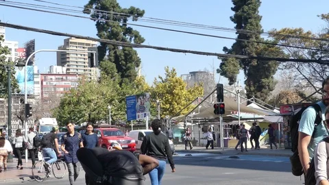 Street performer balancing himself on one foot while people Stock Footage 95958479