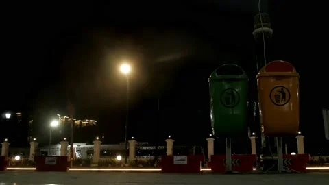Street plastic garbage bins at night Stock Footage 131034671