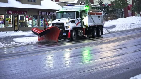 Street plows work to clear  snow in Norwalk on Post Road Stock Footage 325511891