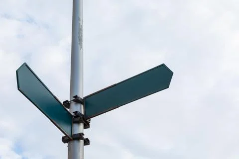 Street pointer with two arrows mock-up Stock Photos
