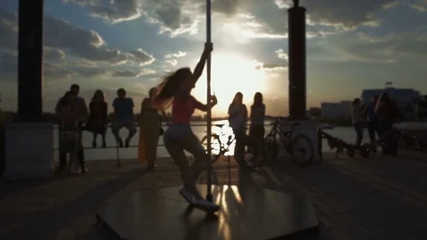 Street Pole dance on sunset out of focus stock footage video Stock Footage 71289013