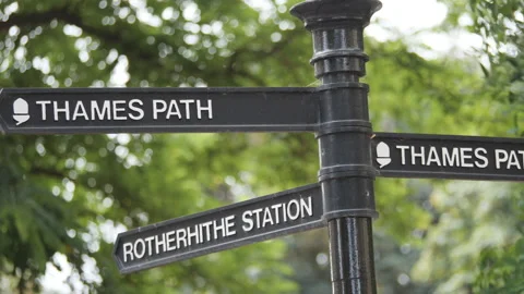 Street pole with direction signs to Thames path. Stock Footage 281787154
