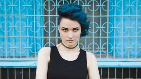 Street punk or hipster girl with blue dyed hair Stock Footage