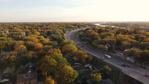 Street Running Through Suburbs Surrounded by Trees During Autumn Stock Footage 140977706