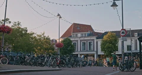 Street Scene with Bicycles and String Lights 8K Stock Footage 339987904