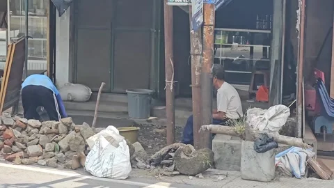 Street Scene Construction Worker And Pedestrian Campurdarat East Java Stock Footage 332195200