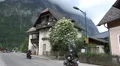 Street scene mountain village Hallstatt with motorcycles HD Footage