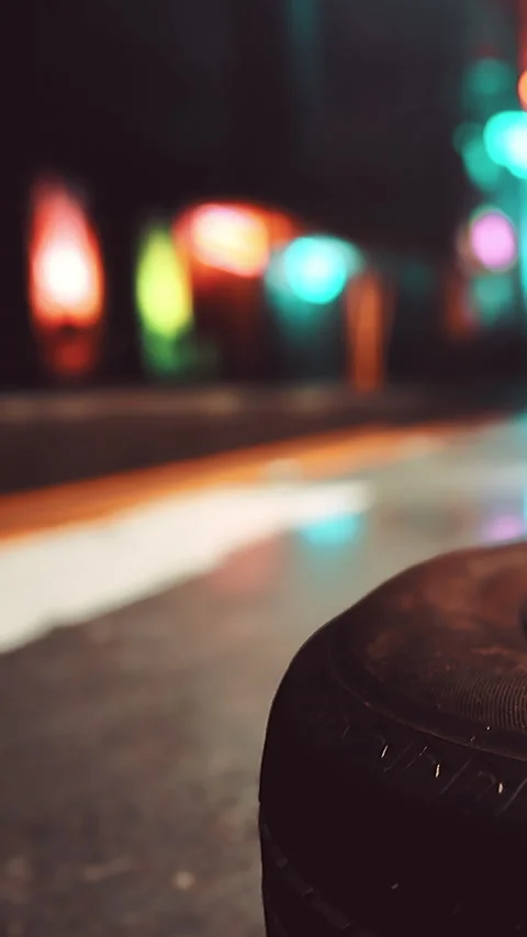 Street scene at night with reflections and neon lights in the background Stock Footage 339403036