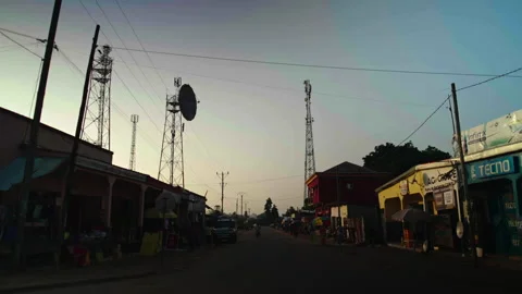 Street with shops both sides, soft sunset light Vídeos de archivo 338167728