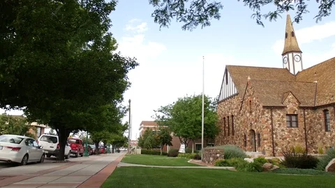 Street side view of stone LDS church with cars Vídeos de archivo 70215887