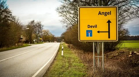 Street Sign Angel versus Devil Stock Photos