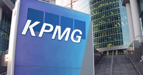 Street signage board with KPMG logo. Modern office center skyscraper and stairs Stock Footage