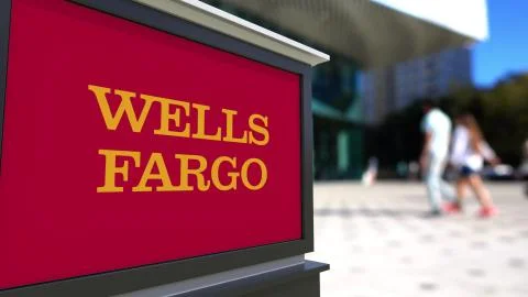 Street signage board with Wells Fargo logo. Blurred office center and walking Stock Illustration