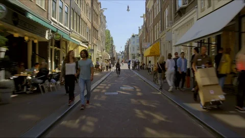 Street with small shops in Amsterdam Stock Footage 89891920