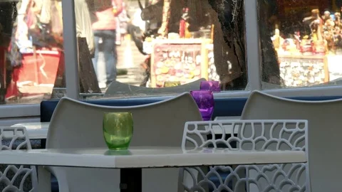 Street table &amp; chairs with mirror reflecting passers by 動画素材 80452109
