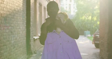 Street theif commits robbery attack on young woman, at day time. frightened Stock Footage 263660753