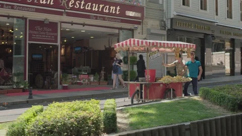 Street traders witch cart run down the street in Istanbul. June 2018 Stock Footage 102909855