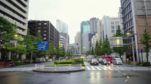 Street Traffic and Large Skyscraper Buildings and Taxi Driving in Tokyo Stock Footage 104469271