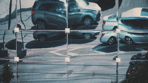 Street traffic distorted reflection on a mirror skyscraper facade Stock Footage 94392382