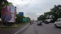 Street traffic scenery pov driving Bali main road big hindu sculpture monument 4k or 4k+ Resolution
