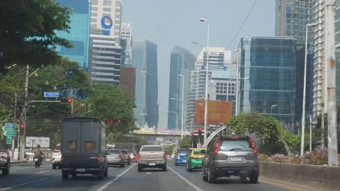 Street traffic view from inside moving car among metropolis of Bangkok city.. Stock Footage 276353248