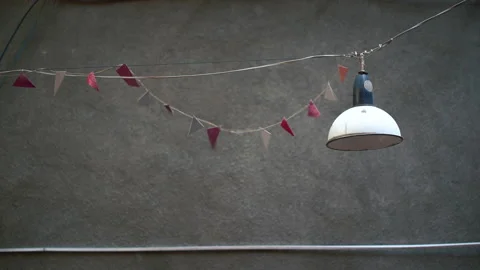 Street triangular flags on a rope,yard decoration the wind blows on a summer day Stock Footage 201306736