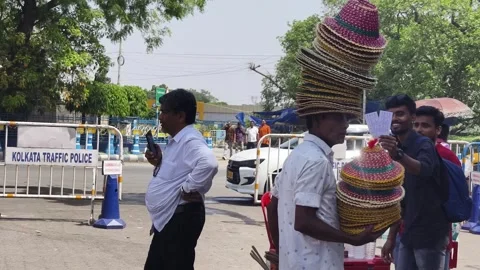 Street Vendor Balancing Stack Of Hats On Head In Kolkata India Stock-Footage 333721472