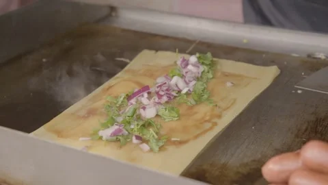 Street Vendor Cooking Filled Flatbread on Griddle in Beijing China Urban Food Stock Footage 345859148