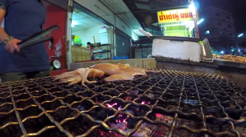 Street Vendor Cooking Seafood on a Fire Stock Footage 61237984