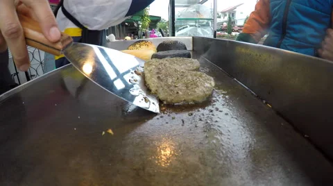 Street Vendor Frying Meat or Cutlet Stock Footage 61237403