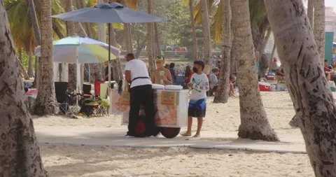 Street Vendor with Ice Cream Cart on San Juan Beach in Puerto Rico, Static Stock Footage