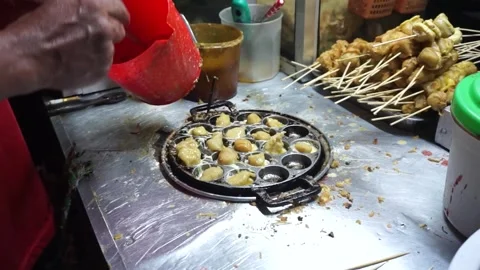 Street Vendor Preparing Takoyaki in Specialized Pan Stock Footage 299196653