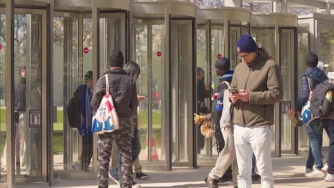 Street Vendors Outside Eiffel Tower Exit in Paris, Tourists Walking Through Stock Footage 335167295