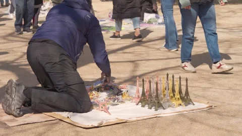 Street Vendors Outside Eiffel Tower Exit in Paris, Tourists Walking Through Stock Footage 335372992