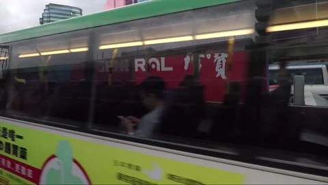 Street View from Bus Window, Bus Stop, Skyscrapers, Kowloon, Hong Kong Stock Footage 344408824